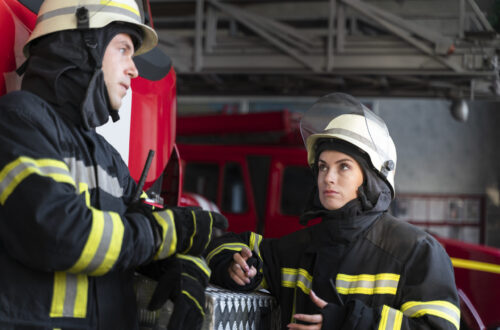 male female firefighters working together suits helmets scaled 1